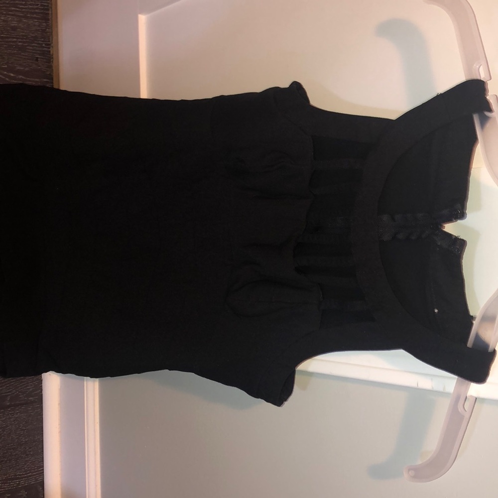 Black form fitting cocktail dress open neck line
